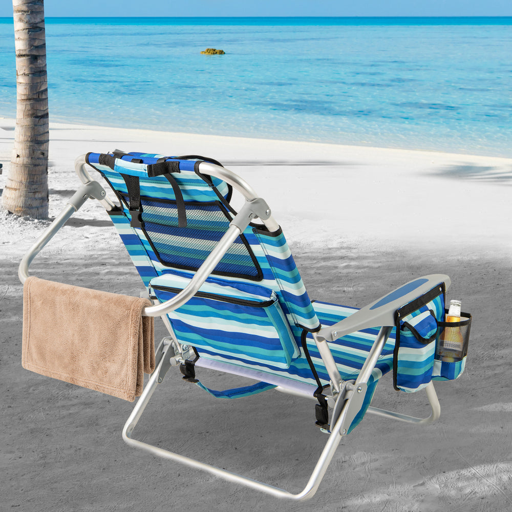 Folding beach chair with adjustable backrest, lightweight aluminum frame, and side pocket for easy outdoor relaxation.