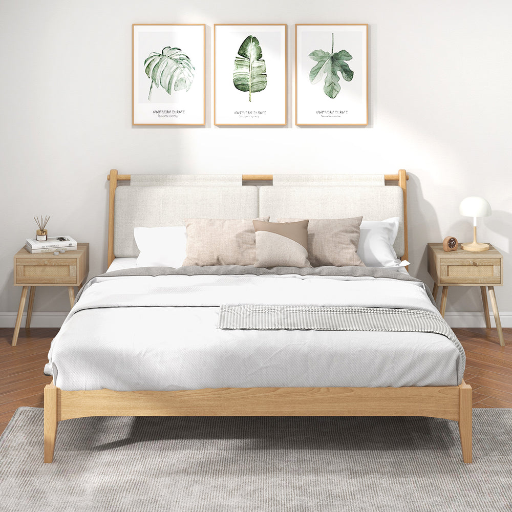 Modern rattan nightstand with drawer and solid wood legs, featuring a natural oak finish for bedroom or living room use.