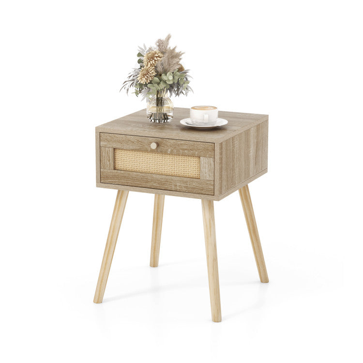 Rattan nightstand with drawer and wooden legs, perfect for stylish bedroom decor and practical storage.