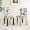 Button tufted beige floral dining chairs with high curved backs, featuring sturdy rubber wood legs for comfort and.