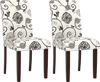 Set of 2 button tufted dining chairs in beige floral fabric with sturdy rubber wood legs for versatile seating.