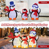 Lighted 2D penguin family decoration with 160 LED lights, featuring a dad and mom in hats and red scarves for festive.