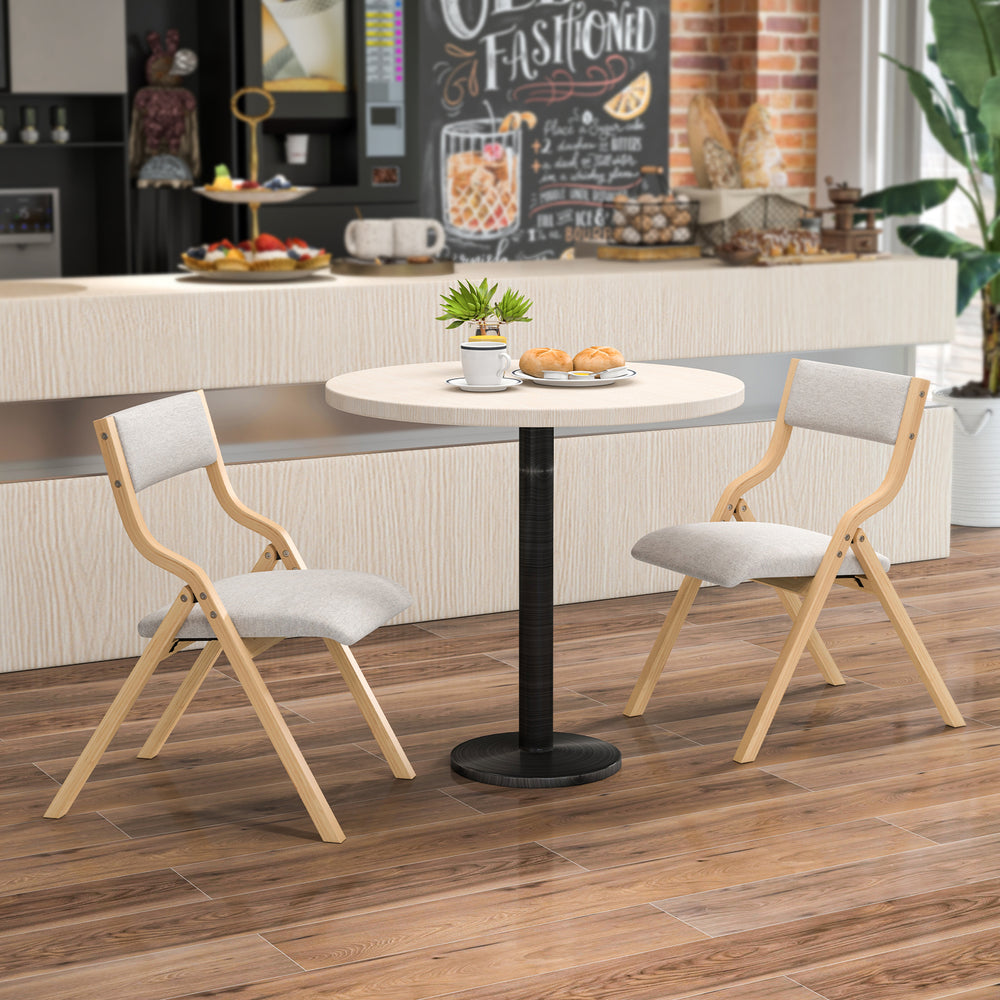 Folding dining chair set with solid wood frame and upholstered cushions, perfect for compact spaces in cafes or homes.