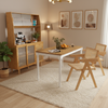 Extendable dining table with 2 rattan accent chairs and a kitchen cabinet, perfect for dining rooms or coffee bar areas.