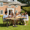 Adjustable wooden picnic table set with UV-resistant umbrella, perfect for outdoor gatherings and sun protection.
