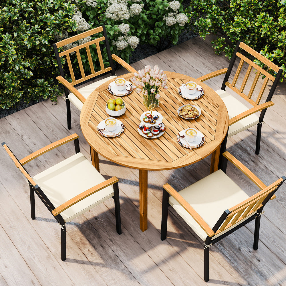 Round acacia wood dining table with metal chairs and cushions, perfect for outdoor patio gatherings.