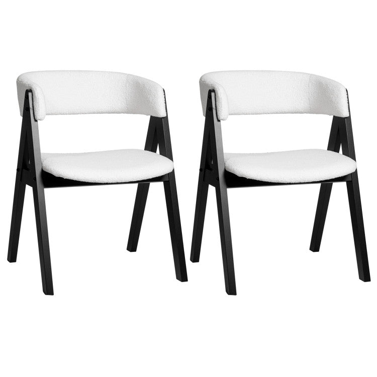 Two upholstered sherpa dining chairs with black rubber wood frames, designed for mid-century modern dining spaces.