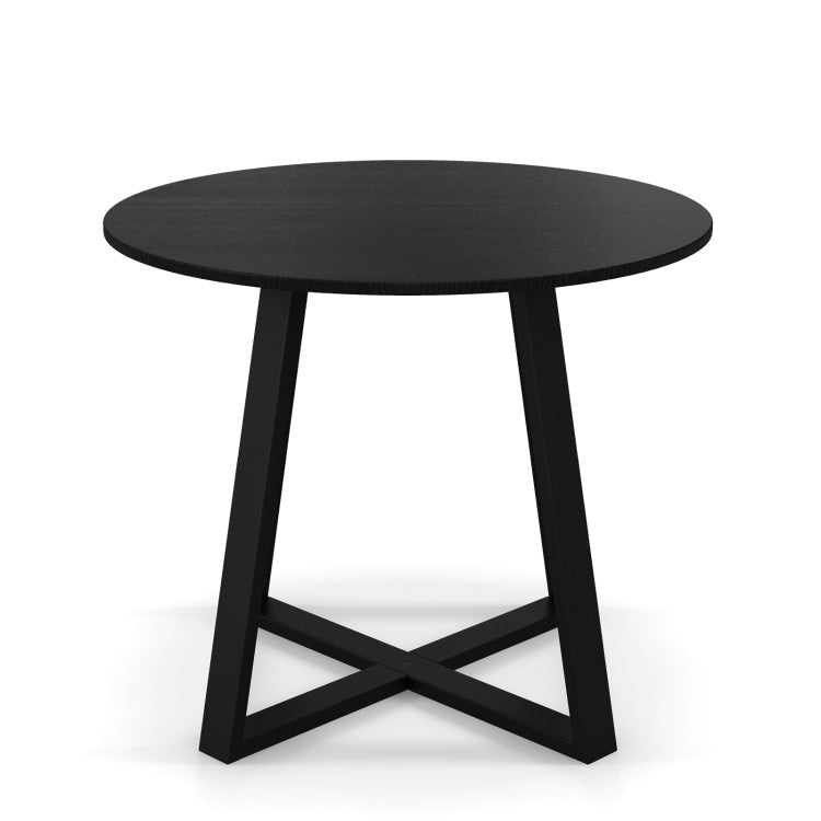 Round pedestal dining table with X-shaped base in black, designed for 2-4 people, perfect for small spaces.