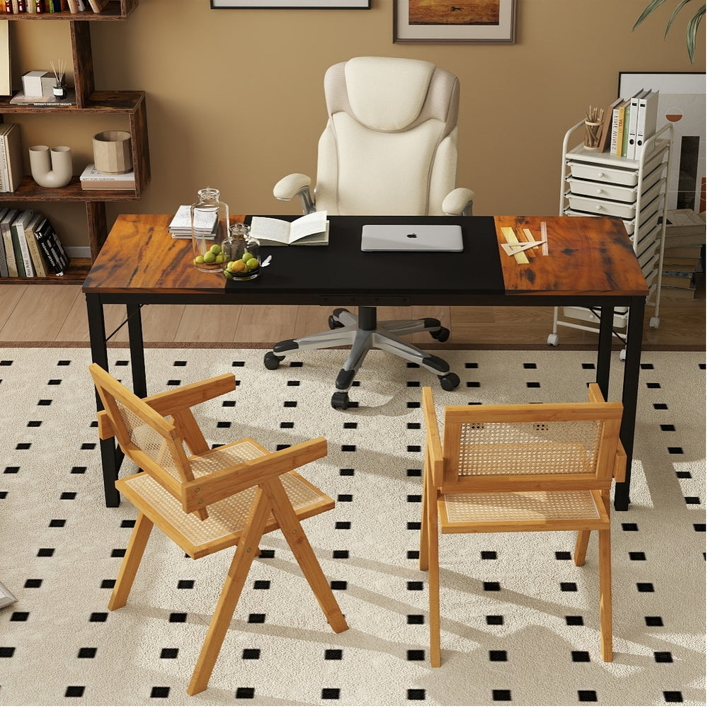 Two rattan accent chairs with bamboo frames in a home office setup featuring a spacious desk and ergonomic chair.