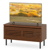 Mid Century fluted TV stand in walnut with spacious tabletop, hidden compartments, and sturdy metal legs for stylish.