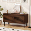 Mid Century fluted TV stand in walnut with metal legs, featuring hidden compartments for organized storage and cable.