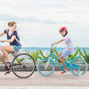 Kids bike in blue with removable basket, training wheels, and helmet, perfect for safe outdoor riding.