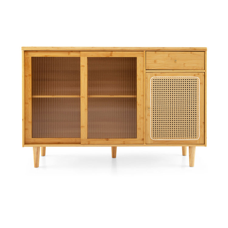 Bamboo sideboard cabinet with rattan door and sliding glass doors, perfect for displaying items in a modern dining room.