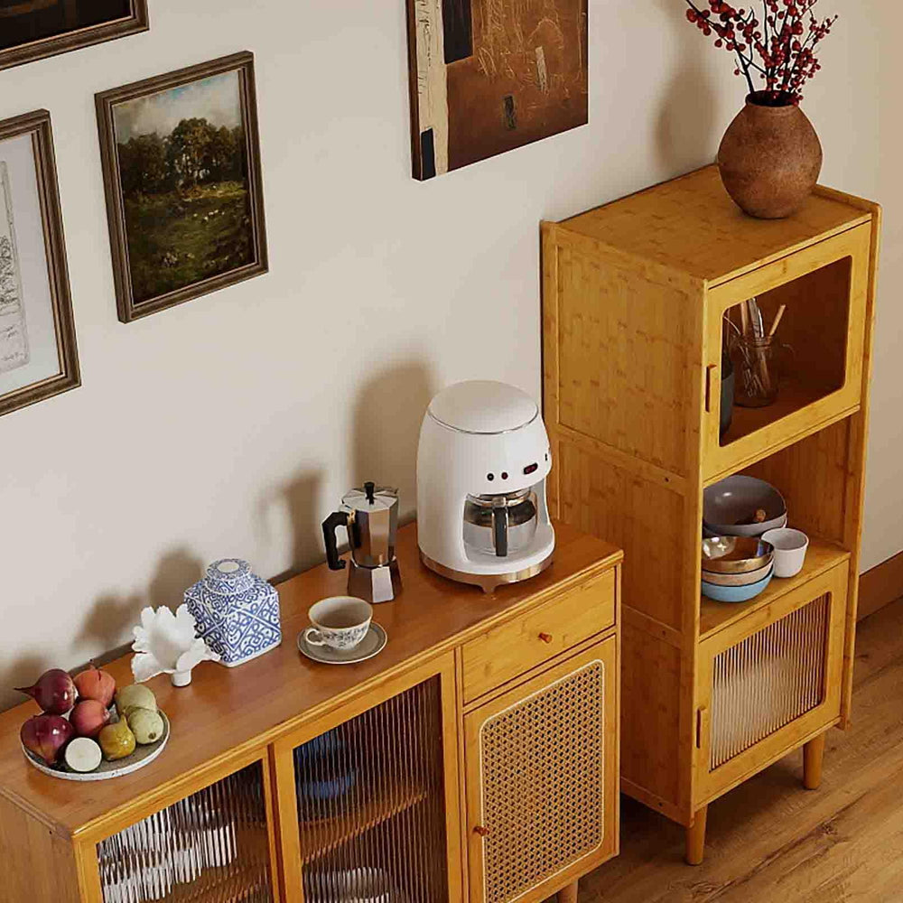 Bamboo sideboard cabinet with rattan doors and a coffee maker, showcasing rustic elegance in a modern dining room.