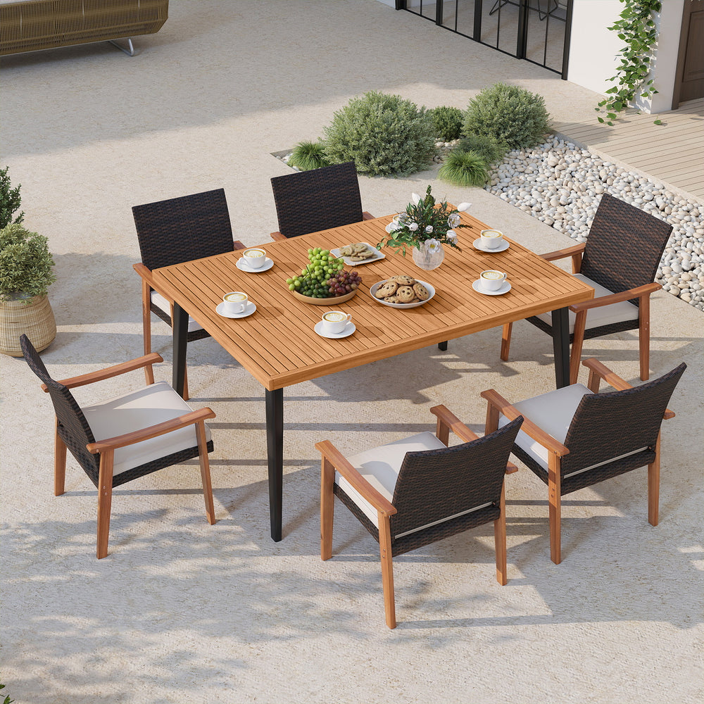 7-piece patio dining set arranged outdoors, showcasing the acacia wood table and stylish armchairs with cushions.