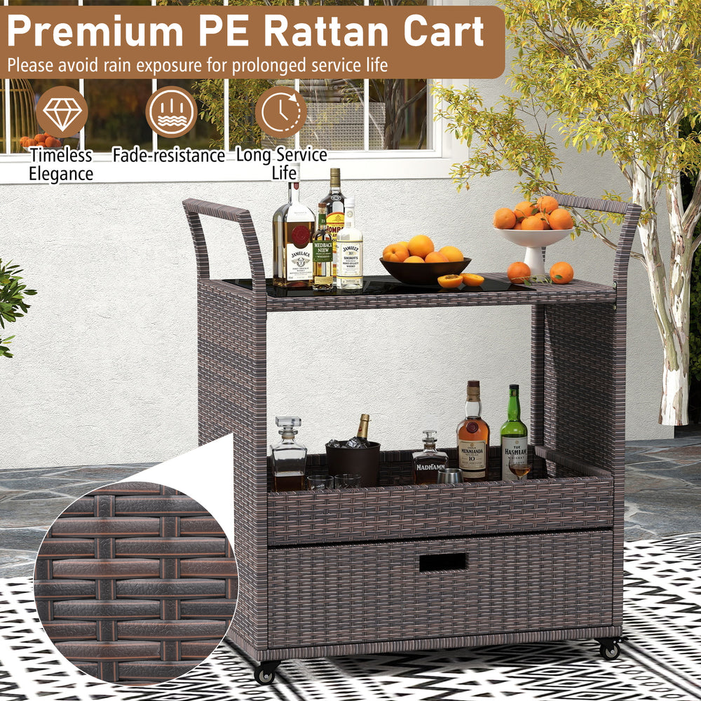 Outdoor wicker bar cart with tempered glass top, made of PE rattan, featuring ample storage and mobility for patio use.