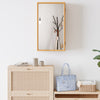 Bamboo small medicine cabinet with mirror door, featuring removable shelves for customized storage and a natural finish.