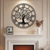 Large 27-inch black metal wall clock featuring a tree of life design, ideal for stylish home decor and easy time.