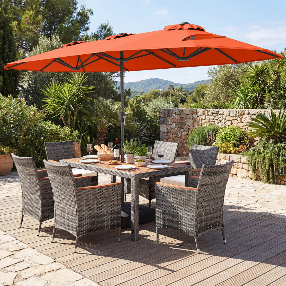 8-piece patio dining set featuring a double-sided orange umbrella and rattan chairs, perfect for outdoor dining.