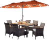 Outdoor wicker dining set with orange umbrella, featuring solar LED lights and ergonomic chairs for patio gatherings.