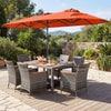 Outdoor wicker dining set with orange 13.5 FT umbrella, featuring ergonomic chairs and acacia wood tabletop for patio.