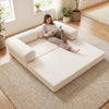 Beige 4-in-1 convertible folding sofa bed in a spacious setting, perfect for lounging or as a floor bed for relaxation.