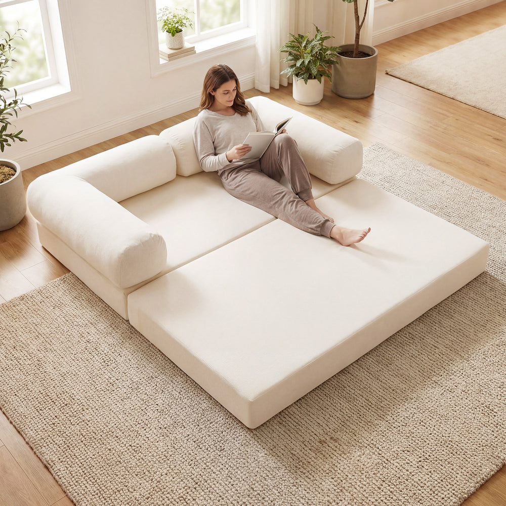 Beige 4-in-1 convertible folding sofa bed in a spacious setting, perfect for lounging or as a floor bed for relaxation.