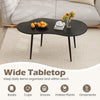 Cloud shape coffee table with a black metal frame, featuring a wide tabletop for organizing items in living spaces.