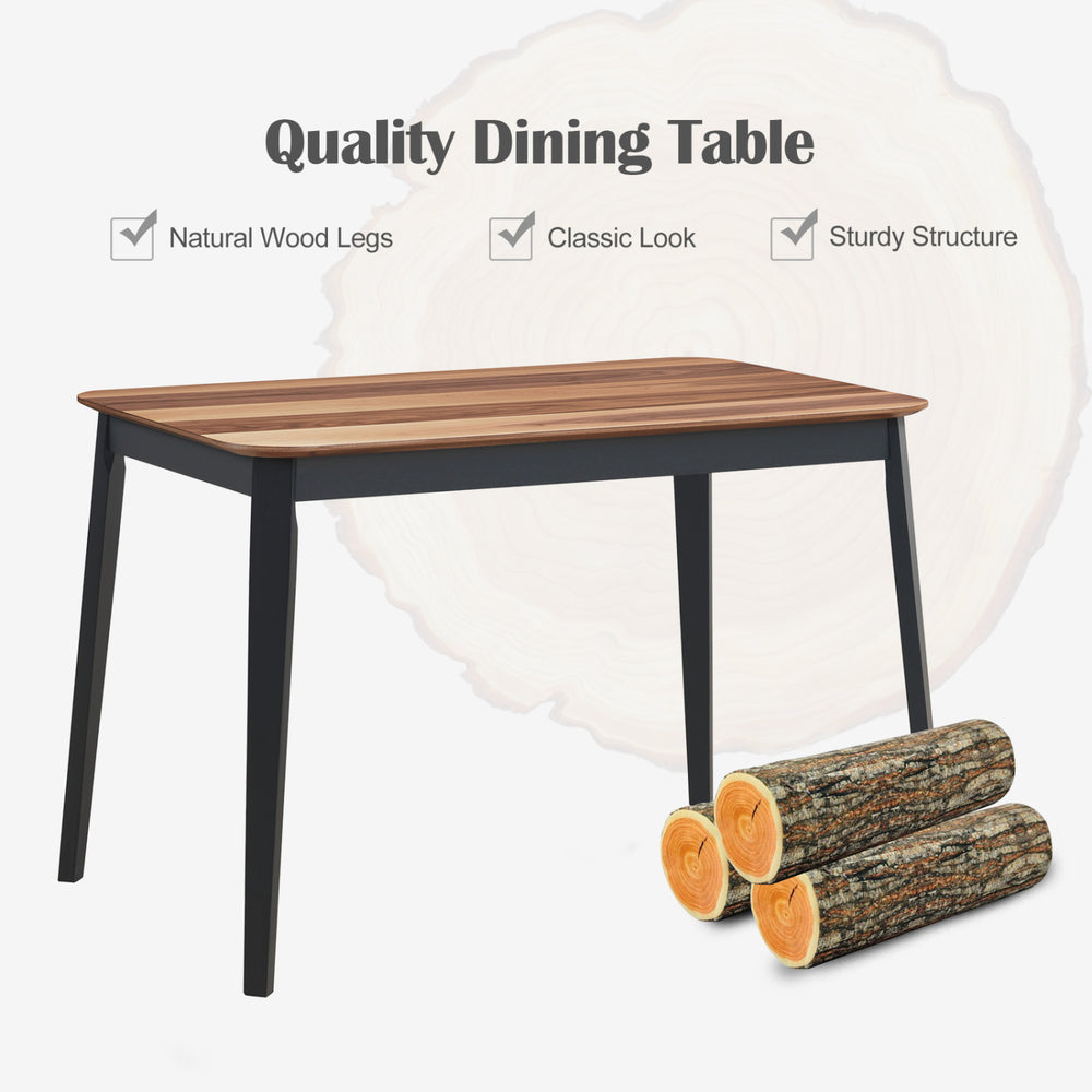 Dining table with walnut wood grain finish and sturdy rubber wood legs, perfect for home kitchens and dining areas.