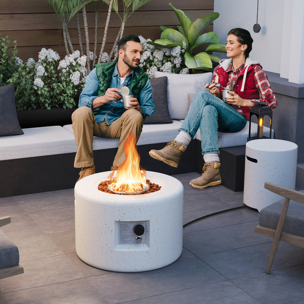 Fire pit table set with a 40,000 BTU output, made of terrazzo, perfect for outdoor gatherings and warmth.