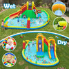 Giant bounce house with two slides, climbing walls, and splash pool for yard parties and family gatherings.