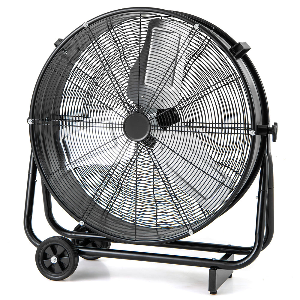 Industrial drum fan with a black metal frame, designed for ventilating large spaces and improving air quality.