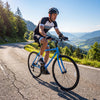 Blue 700C hybrid bike with Shimano 18-speed drivetrain, adjustable saddle, and phone holder for urban rides.