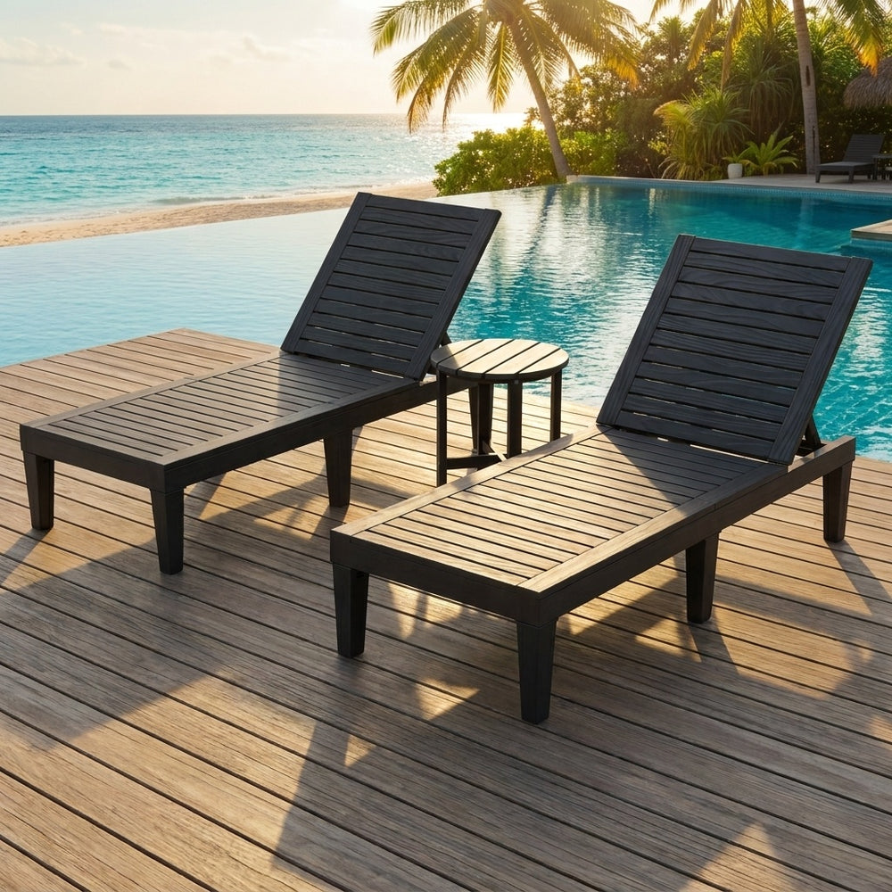 Adjustable recliner chairs and round side table in a 3-piece patio lounge set for poolside relaxation.