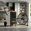 Commercial dehumidifier and heavy-duty metal floor fan combo in a garage setting for efficient air circulation and.