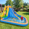 Inflatable water slide with curved slide, colorful balls, and kids playing in the backyard for summer fun.