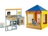 Kids outdoor play center featuring a wooden mud kitchen, picnic table, and sandbox with a protective canopy in a.