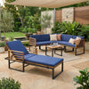 Chaise lounge and conversation sofa set in acacia wood, featuring blue cushions for stylish outdoor relaxation.
