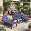 Acacia wood patio furniture set featuring a chaise lounge, conversation sofa, and dining table for outdoor gatherings.