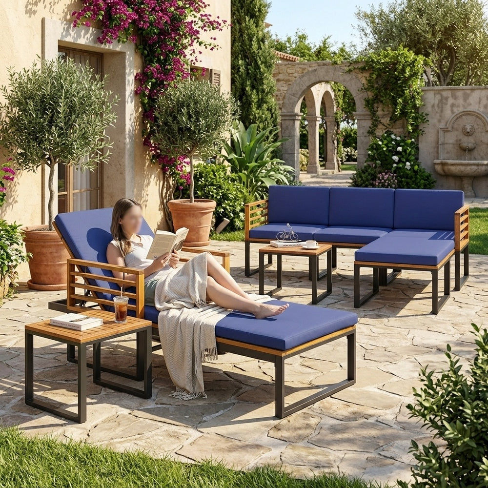 Side view of the 7-piece acacia wood patio furniture set, showcasing the spacious conversation sofa and chaise lounge.