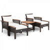 Two lounge chairs with soft cushions and a wicker side table, perfect for outdoor relaxation in any garden or patio.