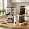 Espresso machine with 20-bar pressure, conical burr grinder, and milk frother for creating rich coffee drinks at home.
