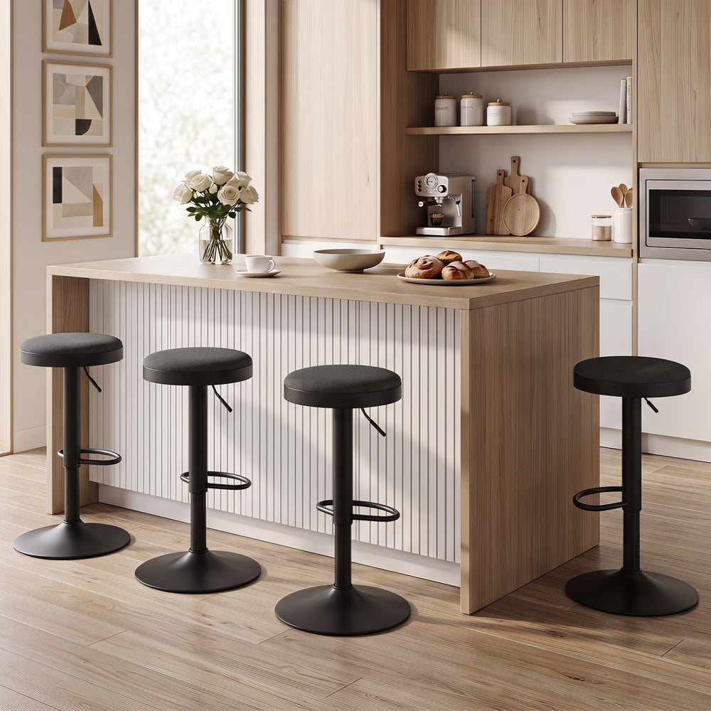 Set of 2 black kitchen bar stools with height adjustment, padded seats, and D-shaped footrests for versatile use.