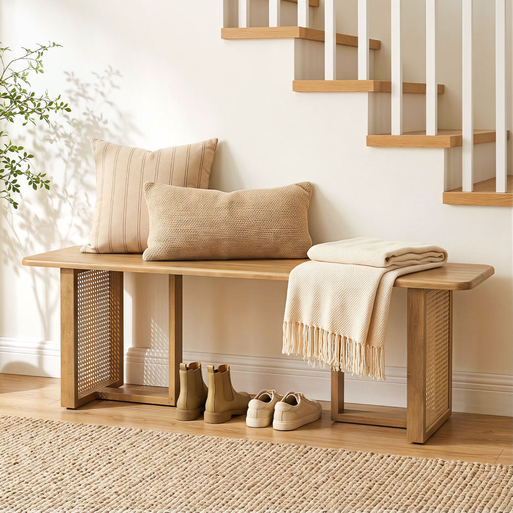 Natural 55” solid rubber wood dining table set with two benches, featuring woven resin wicker details for a boho style.