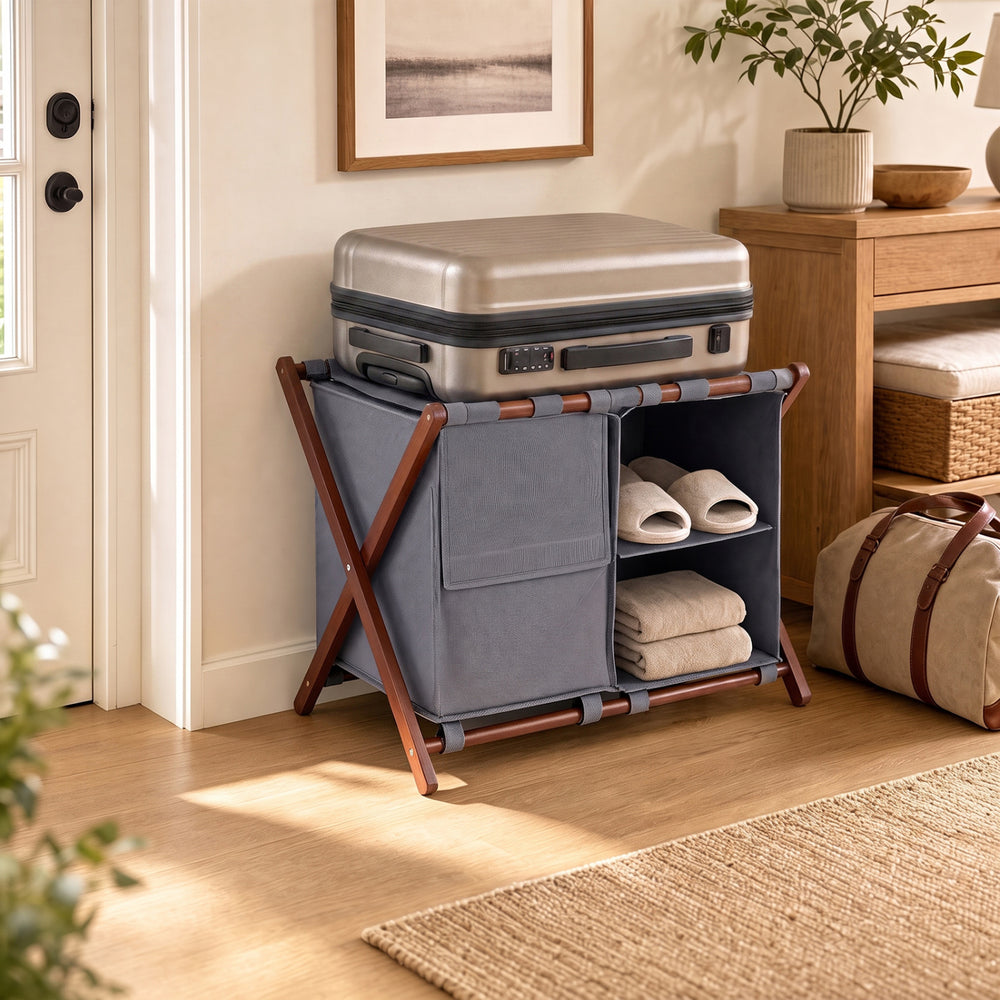 Bamboo luggage rack with 5 nylon straps and compartments, designed for guest rooms and supporting up to 155 lbs.