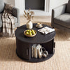 Round black coffee table showcasing a spacious tabletop and sliding tambour door for stylish and practical living room storage.