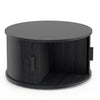 Round black coffee table with storage, featuring a sliding tambour door and fluted design for stylish organization.