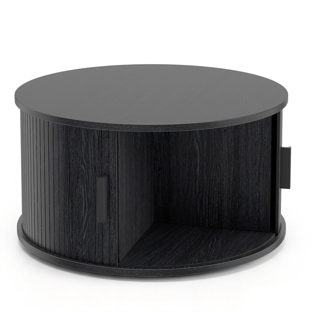 Round black coffee table with storage, featuring a sliding tambour door and fluted design for stylish organization.