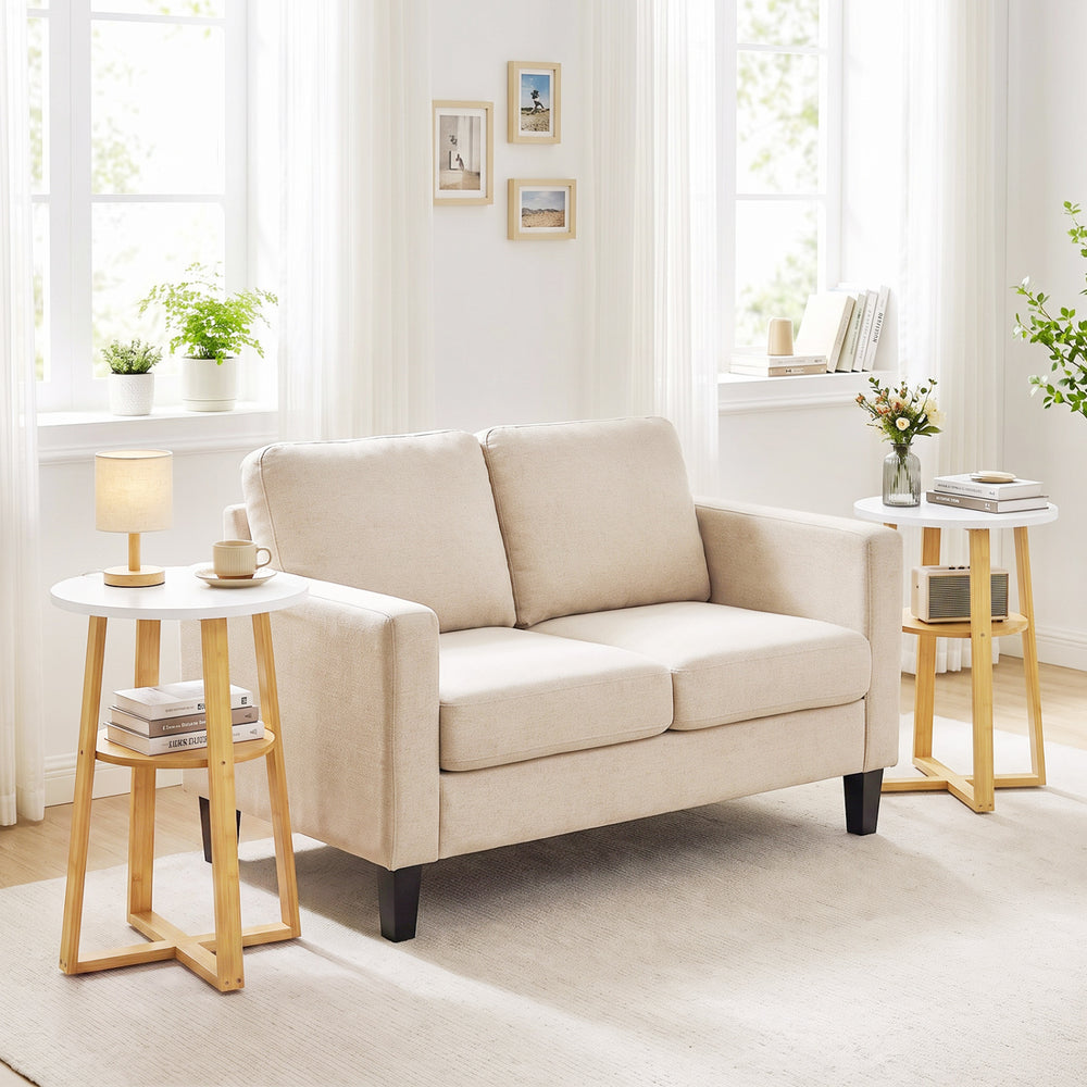 White and natural 2-tier end table set with X-shaped base, perfect for magazines and plants in any living space.