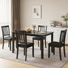Rectangular 48" black kitchen table with solid rubber wood legs and four chairs, perfect for dining room gatherings.